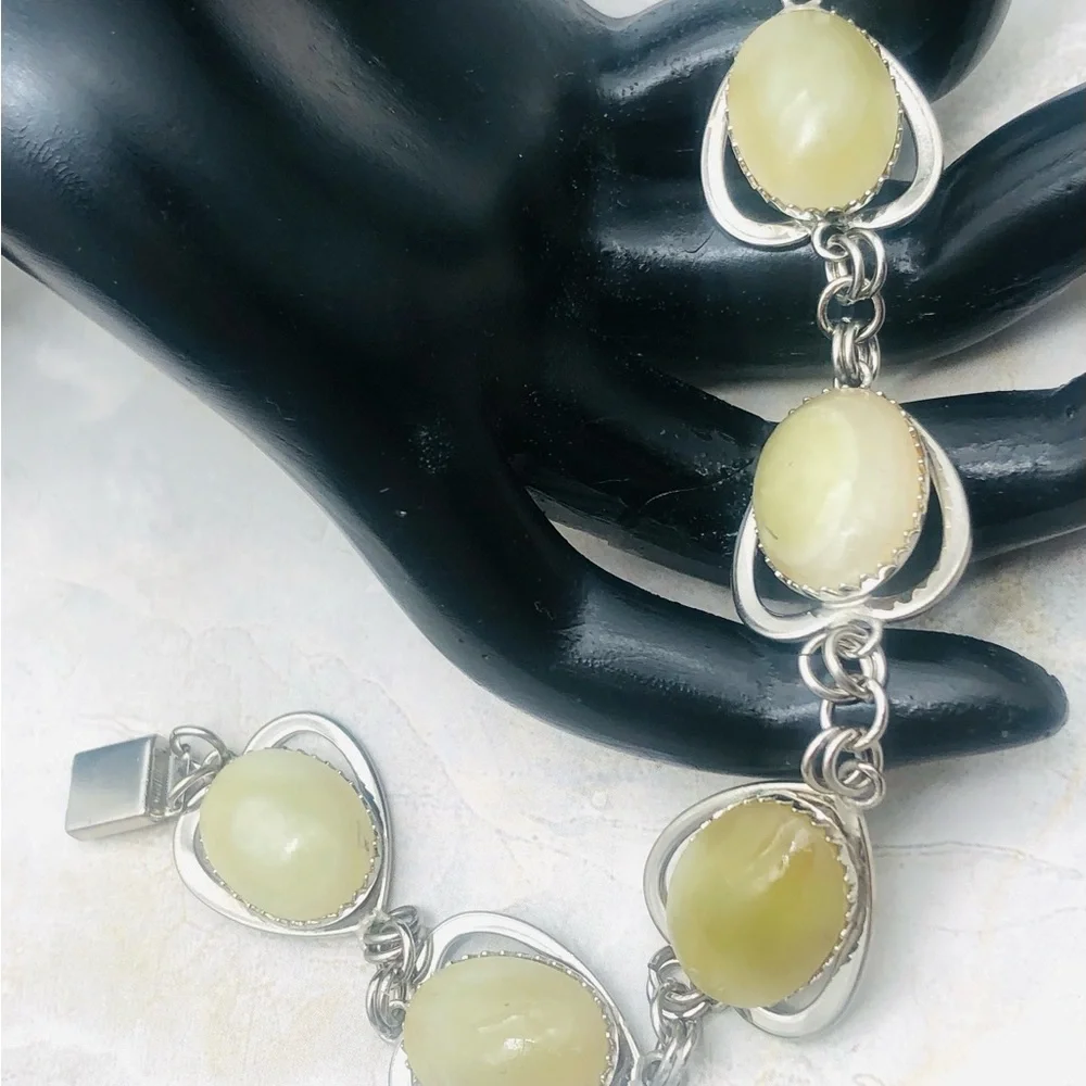 Rhodium Plated Bracelet with Pale Green Amber Cabochons